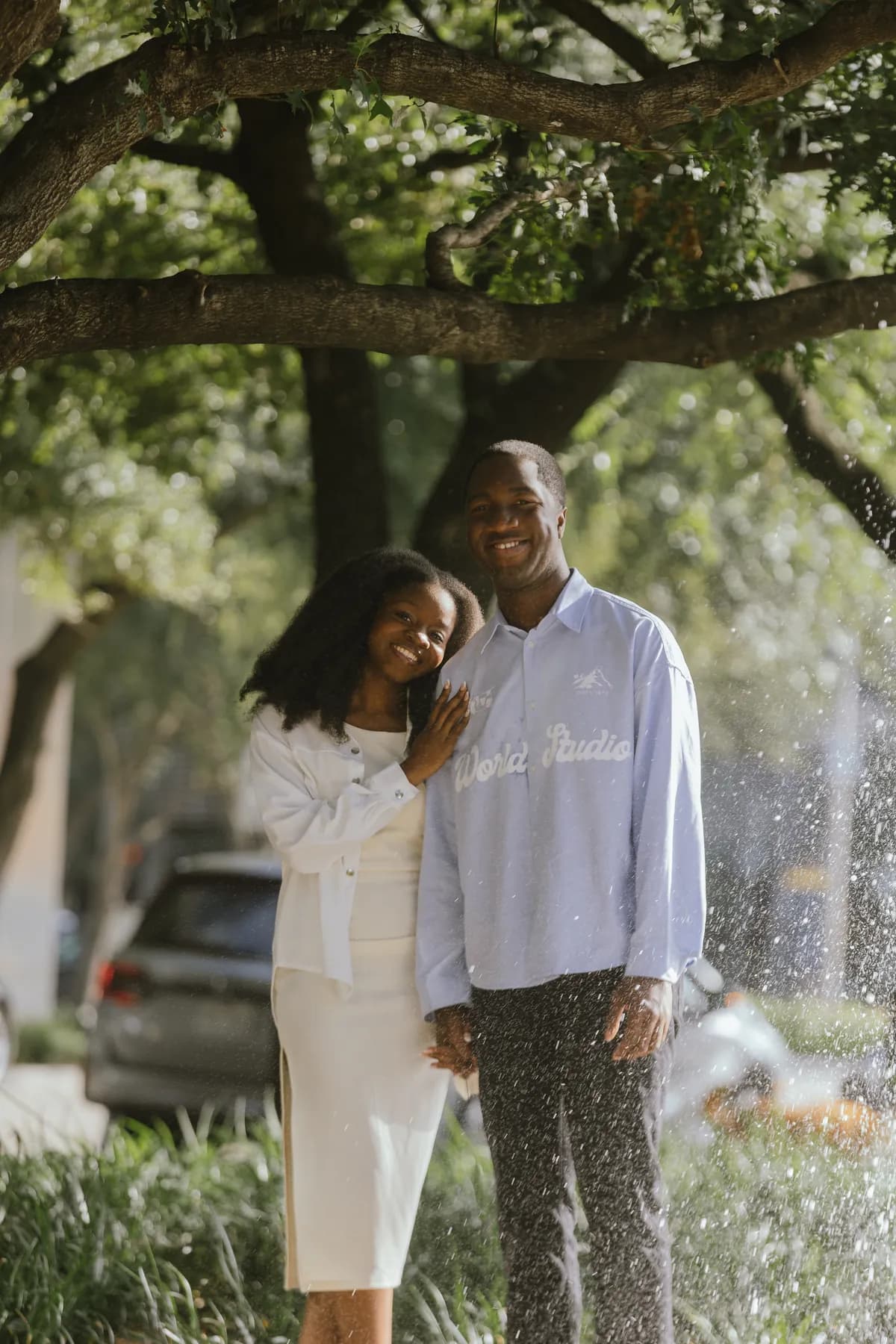 Afriyie leaning into Jeremy under the trees